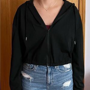 Black zip up hoodie.
